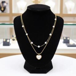 Maison Accessoire - Collier doré avec perles a motif cœur blanc